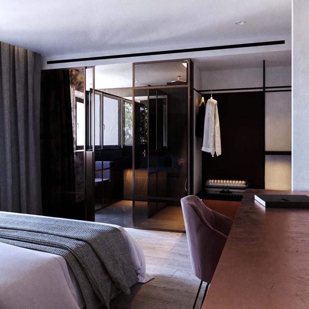 Habitaci&oacute;n del Hotel OLOM con cama y espejo